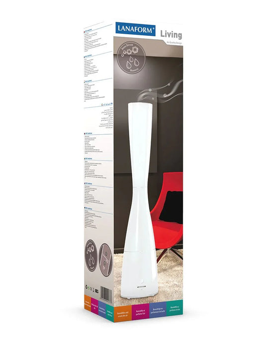 Lanaform Living witte luchtbevochtiger en geurverspreider naast rode stoel in moderne woonkamer